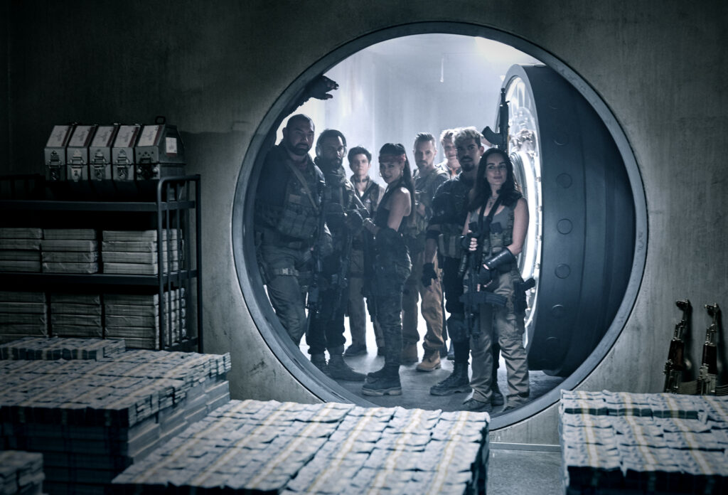 ARMY OF THE DEAD (L to R) DAVE BAUTISTA as SCOTT WARD, OMARI HARDWICK as VANDEROHE, TIG NOTARO as PETERS, SAMANTHA WIN as CHAMBERS, COLIN JONES as DAMON, MATTHIAS SCHWEIGH
FER as DIETER, RAôL CASTILLO as MICKEY GUZMAN, ANA DE LA REGUERA as CRUZ in ARMY OF THE DEAD. Cr. CLAY ENOS/NETFLIX © 2021