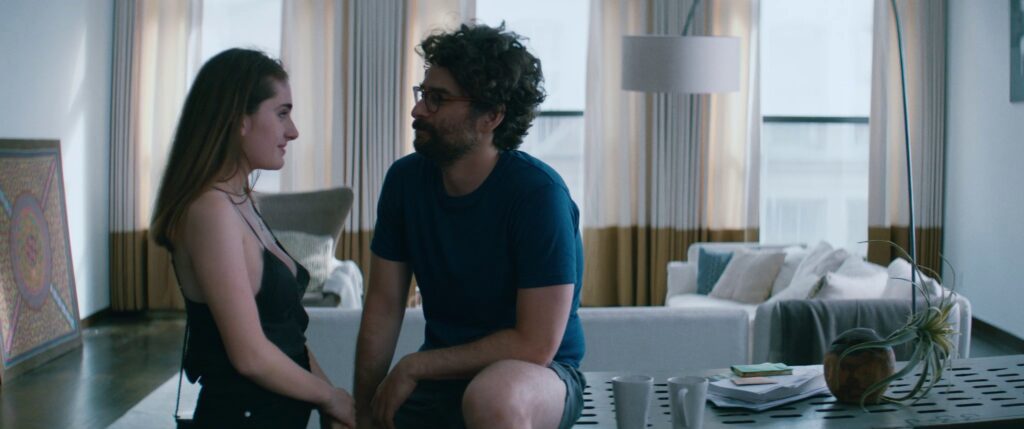 Rachel Sennott and Danny Deferrari as Danielle and Max in Soho apartment in Shiva Baby