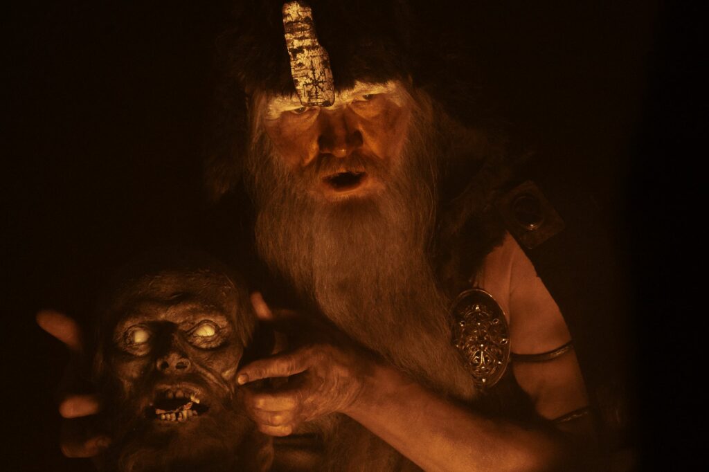 Willem Dafoe severed head in Robert Eggers Viking epic The Northman