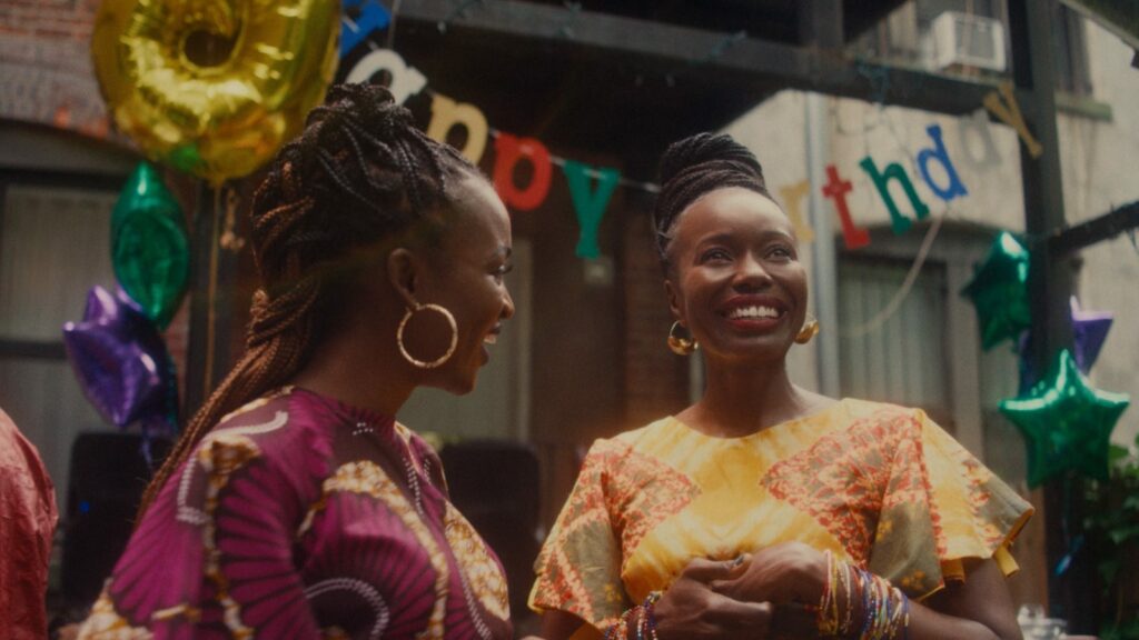 Aisha (Anna Diop) celebrates a birthday party with friend Sallay (Zephani Idoko) in Nanny