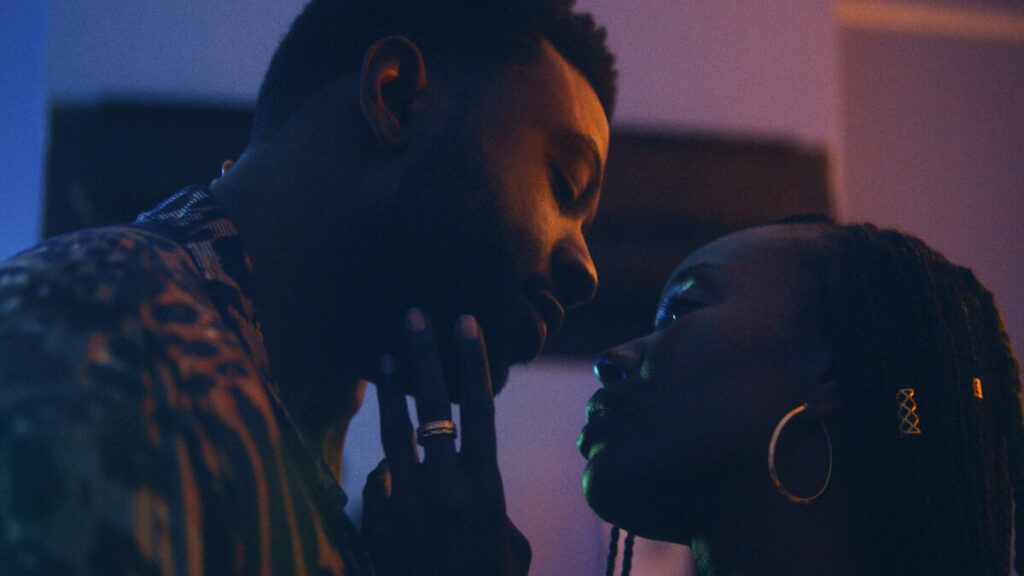 Malik (Sinqua Hall) and Aisha (Anna Diop) share an embrace in Nanny